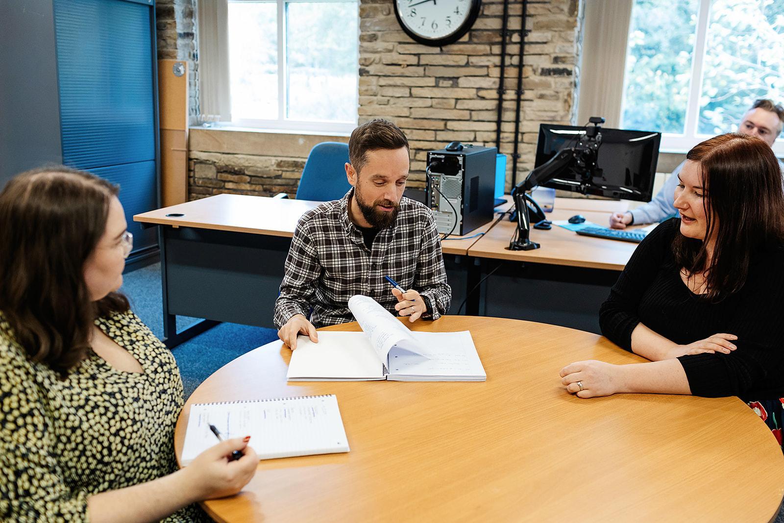 Enventure Research team discussing a research project